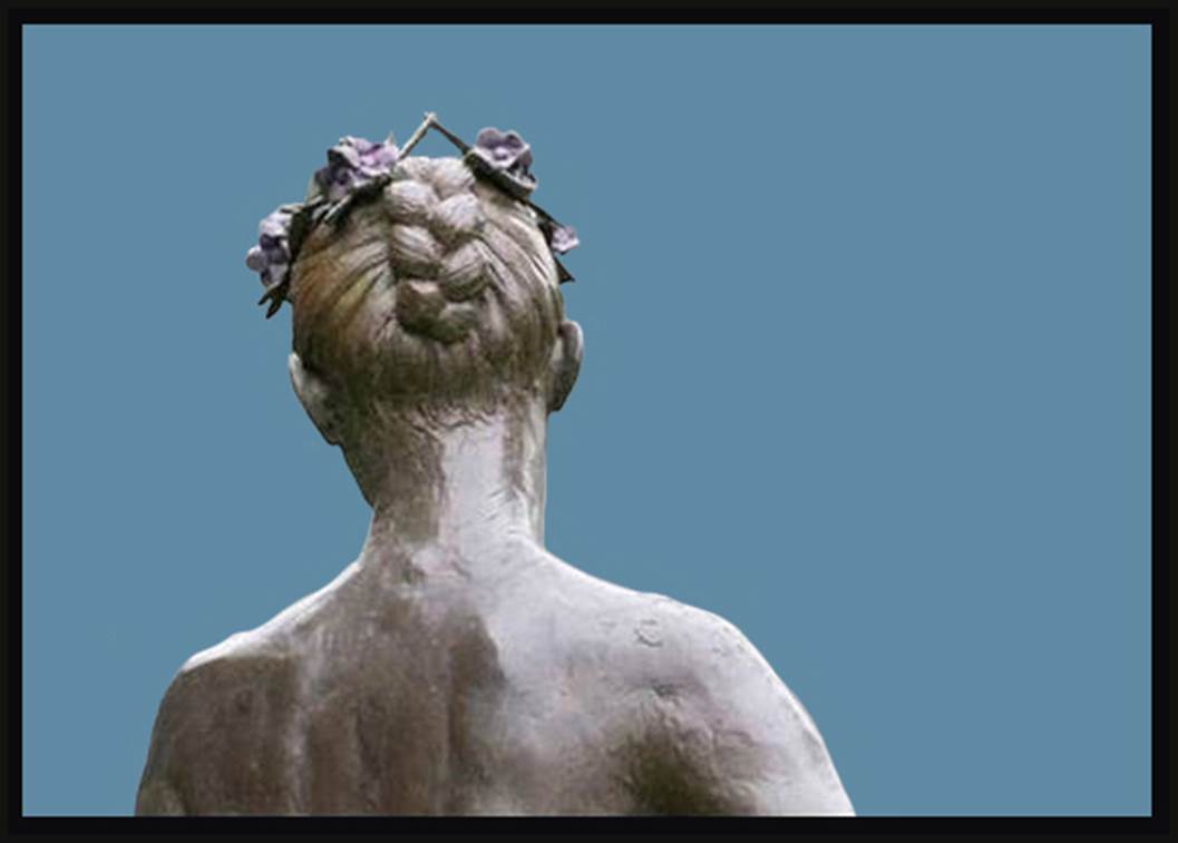 A statue of a man with flowers in his hair.