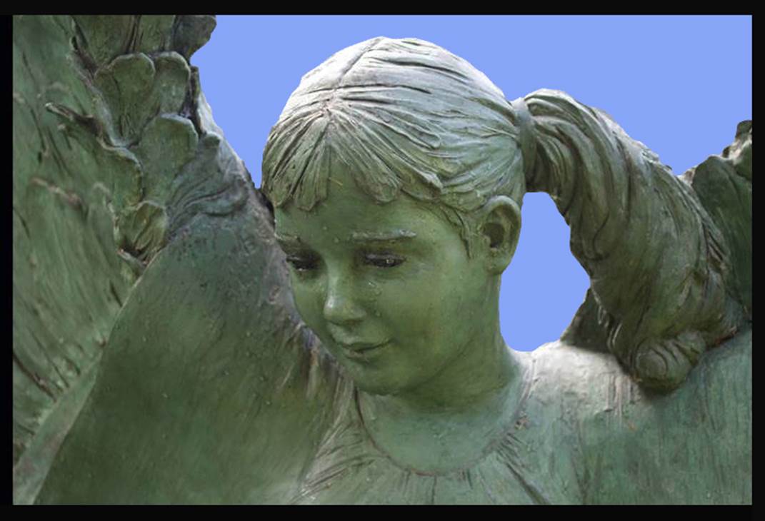 A statue of a girl with her head tilted to the side.
